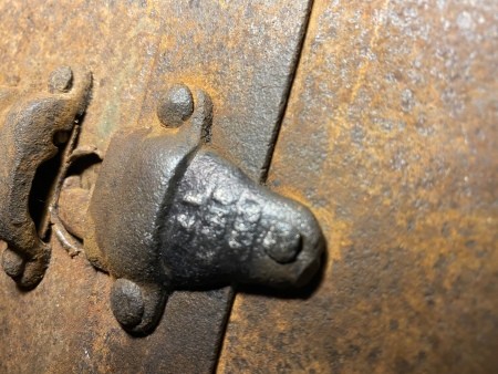 Hardware on a steamer trunk.