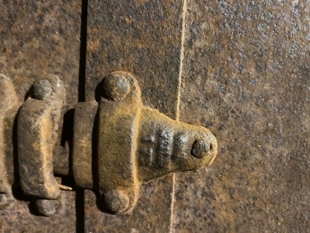 Hardware on a steamer trunk.
