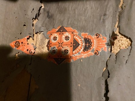 A colorful design on the steamer trunk.