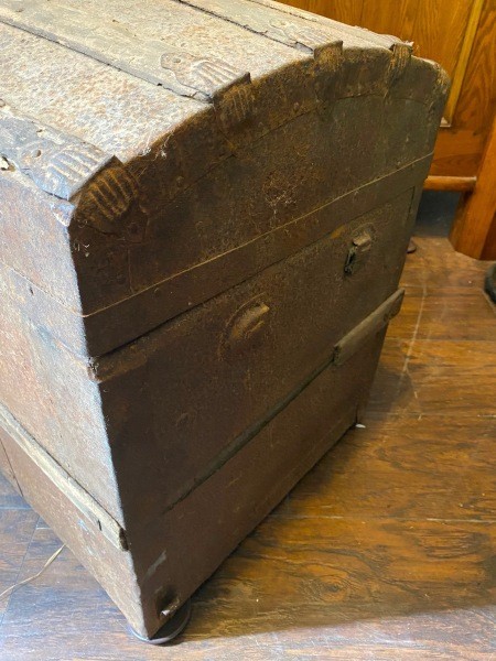 The side of an old steamer trunk.
