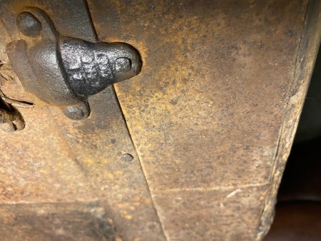 Hardware on a steamer trunk.