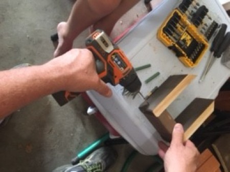 Assembling the birdhouse.