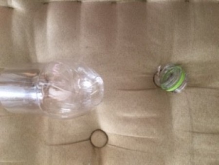 Cut pieces of plastic bottle.