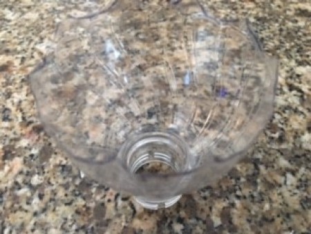 The cut top of the bottle.