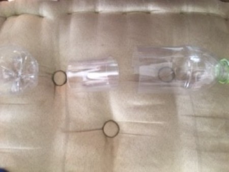 A plastic bottle cut into pieces.