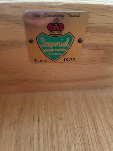 An Imperial furniture logo inside a drawer.