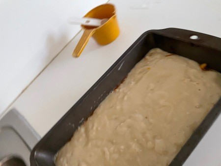 The loaf of bread in a pan.