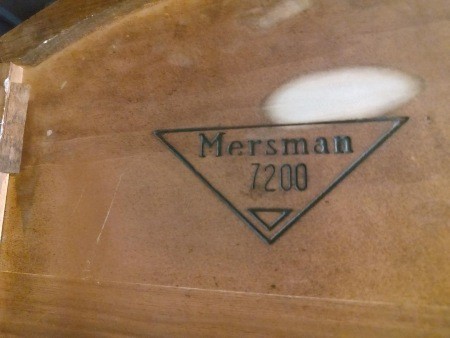The Mersman marking on the underside of a table.
