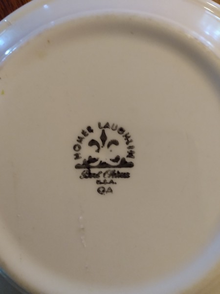 The marking on the back of a plate.