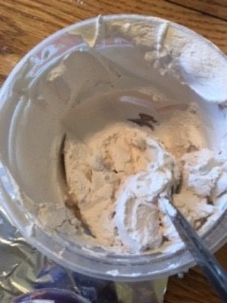 Mixing plaster of Paris.