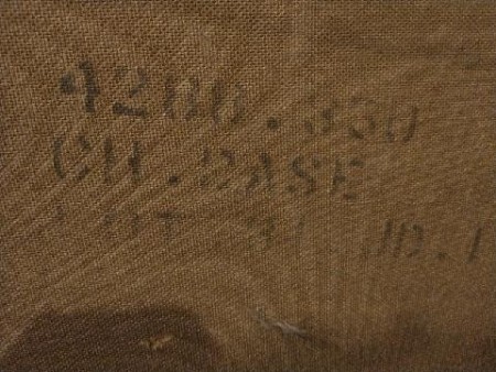 Markings on the back of a china hutch.