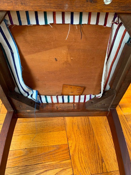 The underside of a wooden chair