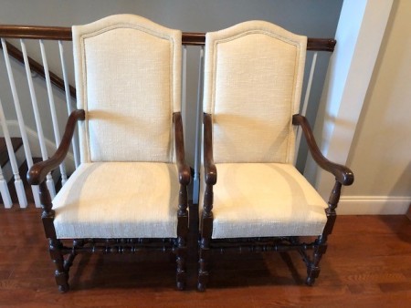 Dining chairs upholstered in white.