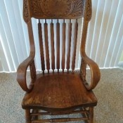 A wooden rocking chair.