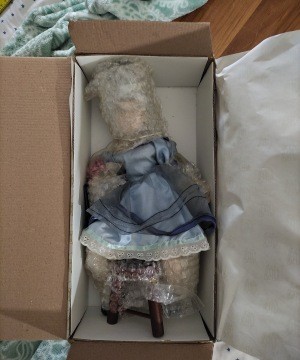 A porcelain doll in the original box.