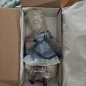 A porcelain doll in the original box.
