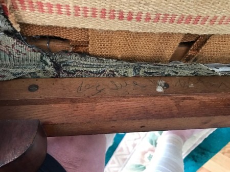 The underside of an antique chair.