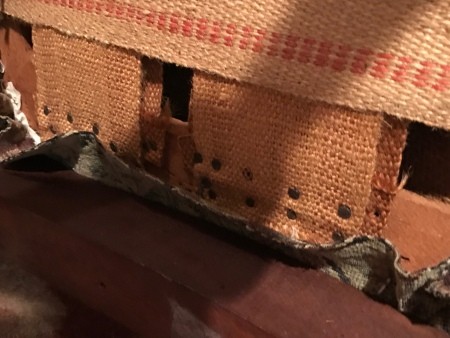 The underside of an antique chair.