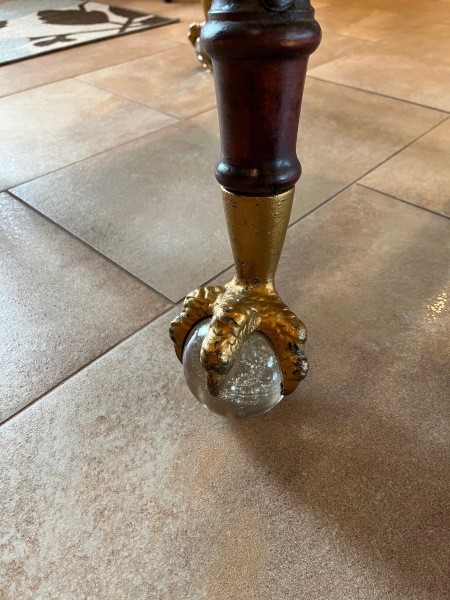 The ball and claw construction on the end of the table legs.