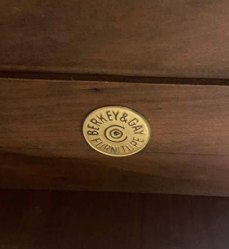 The manufacturer's marking on a piece of furniture.