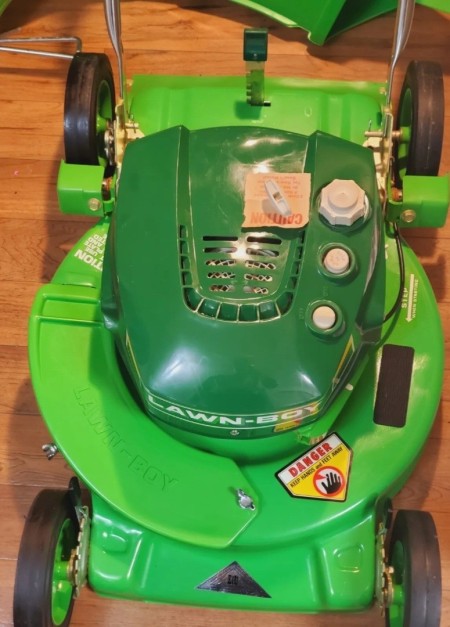 A green lawn mower.