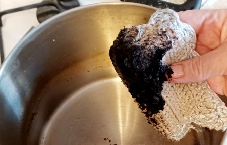 Wiping out the burned residue.