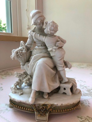 A figurine of a woman and child.