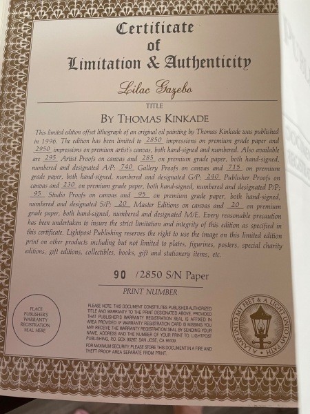 The certificate of authenticity for a Thomas Kinkade painting.
