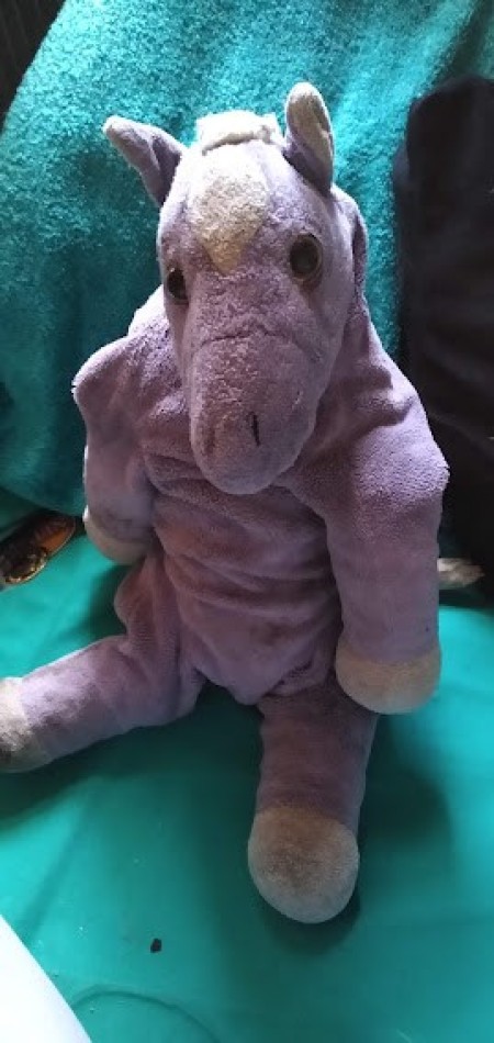 A small purple stuffed horse.