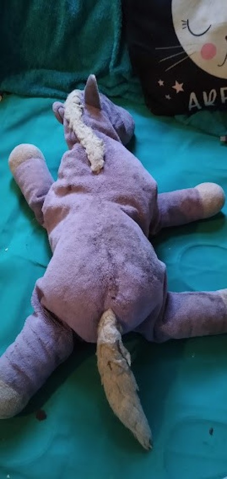 A small purple stuffed horse.