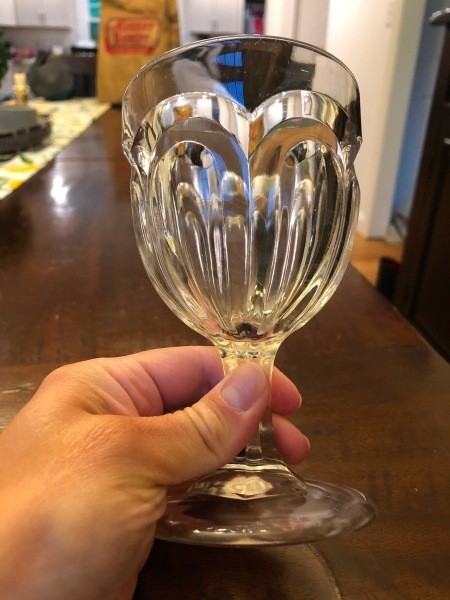 Decorative clear water goblets.