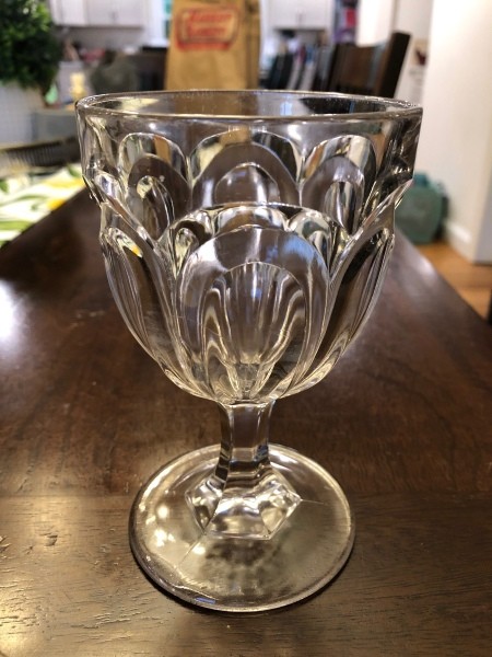 Decorative clear water goblets.