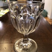 Decorative clear water goblets.