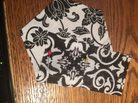 Pinning the fabric together.