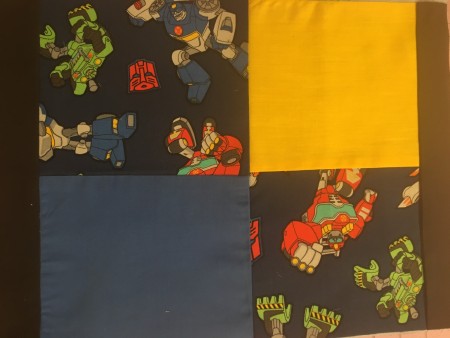 Sewing the fabric in a patchwork fashion.