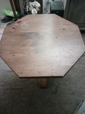 An octagonal wooden side table.