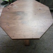 An octagonal wooden side table.