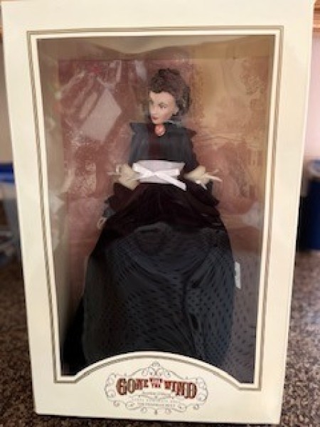 A vinyl doll in a box.