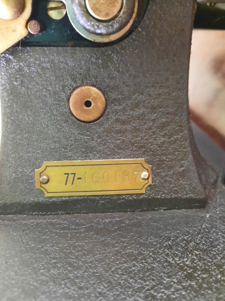 The serial number on the sewing machine.