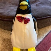 The front of a toy penguin.