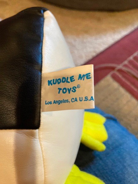 The tag on a toy penguin.