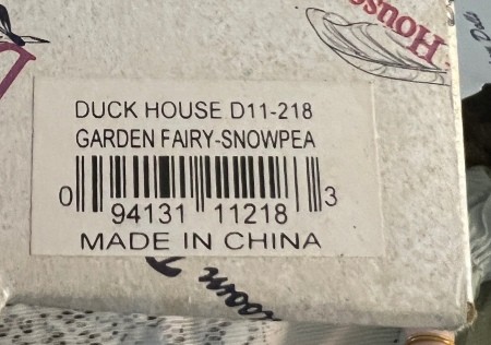 The original box for a porcelain doll.