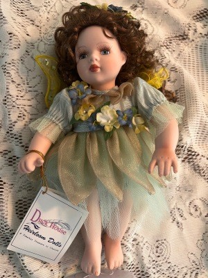 A porcelain doll with original tag.