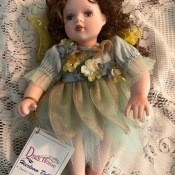 A porcelain doll with original tag.