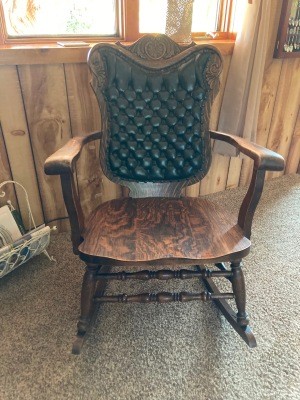 A wooden rocking chair.