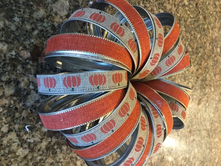 The canning jars attached in a pumpkin shape.