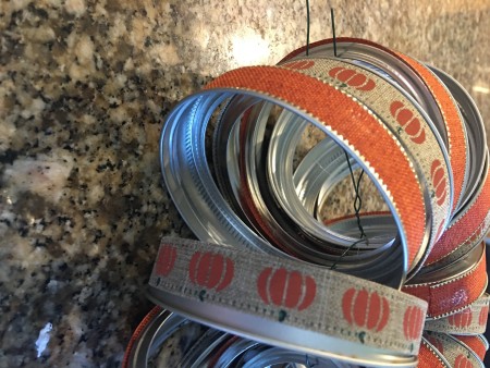 Gathering the canning jar lids in alternating colors.