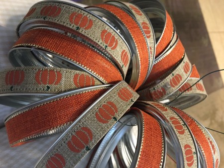 Attaching the canning jars in a pumpkin shape.
