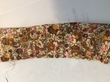 Sewing an edge to bunch the fabric.