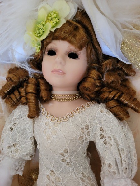 A porcelain bridal doll.